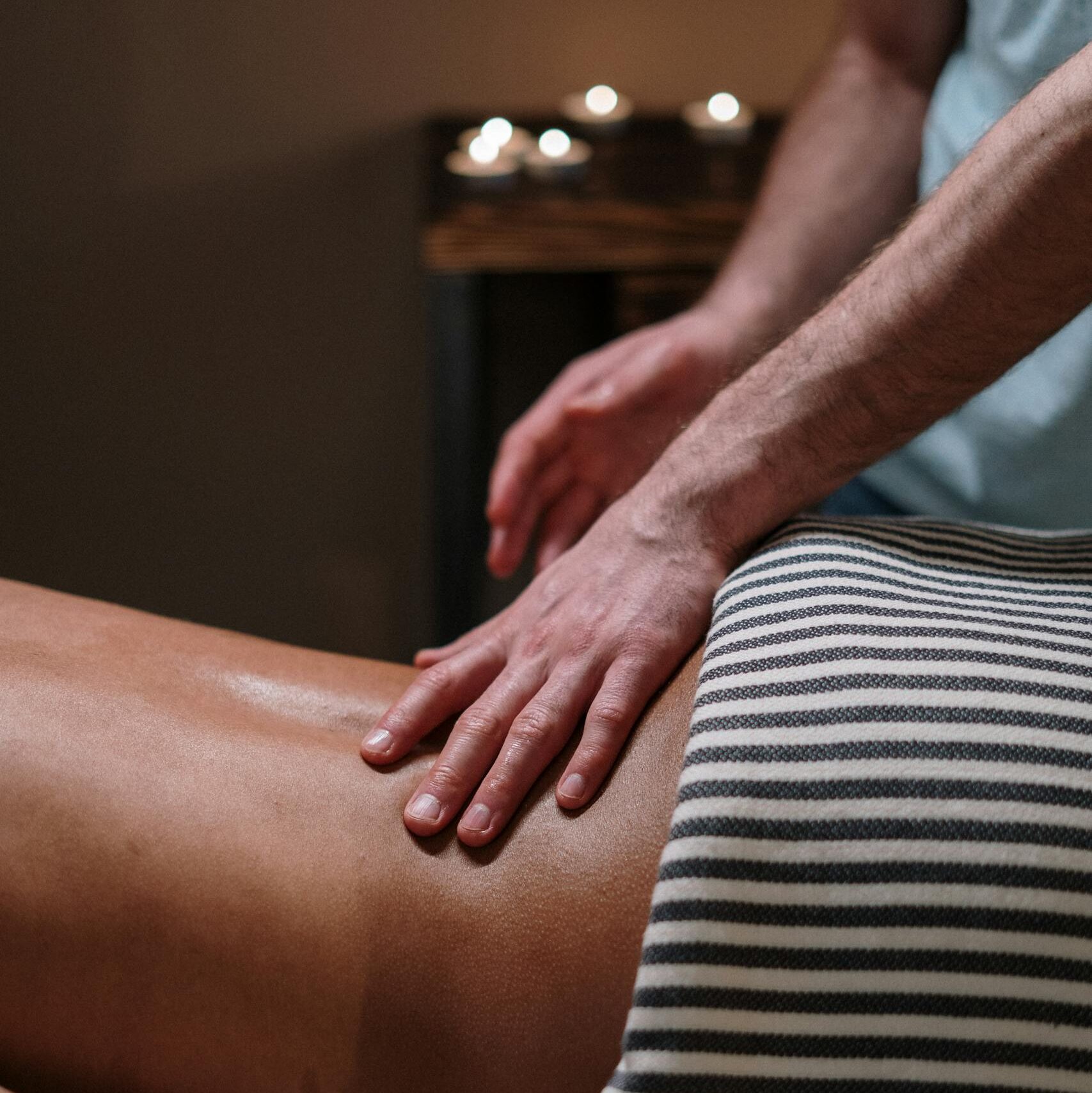 A calming spa massage focusing on relaxation and wellness with candlelit ambiance.